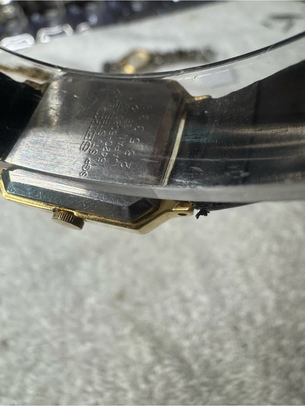 Seiko Gold Tone Square Watch with Silver Dial and Black Strap
